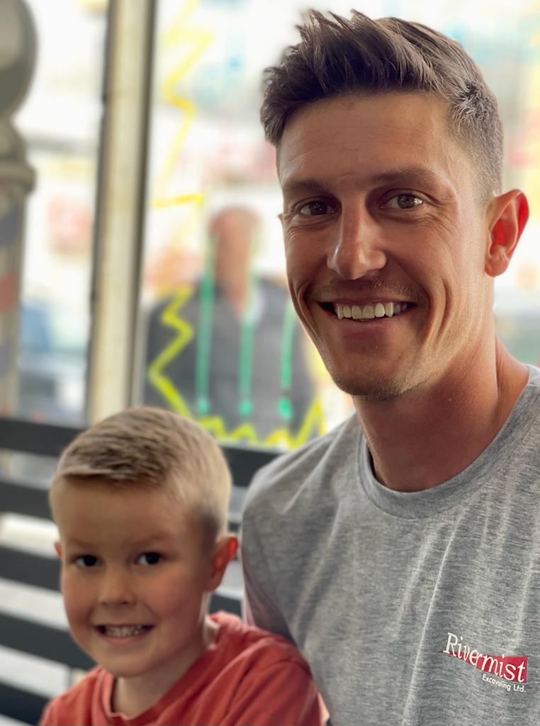 Happy dad and son at Continental Barbershop in downtown Kamloops