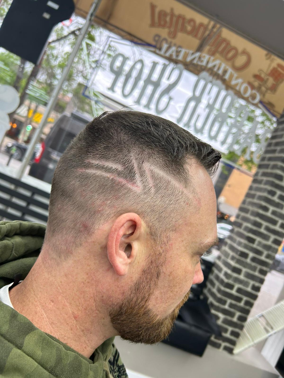Low taper fade with hair design — Continental Barbershop Kamloops