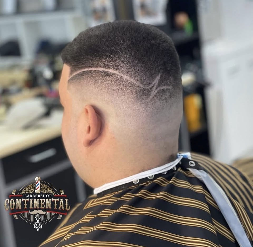 Razor design with skin fade at Continental Barbershop Kamloops