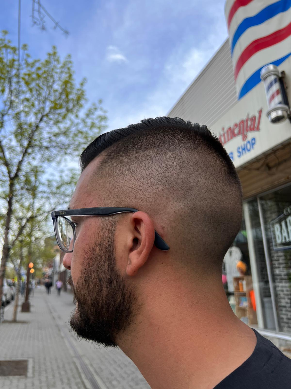 Mohawk skin fade outside Continental Barbershop on Victoria Street
